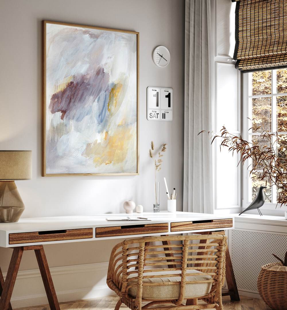 Ethereal brushstrokes in abstract paintings enhance a stylish workspace, perfect for modern decor.