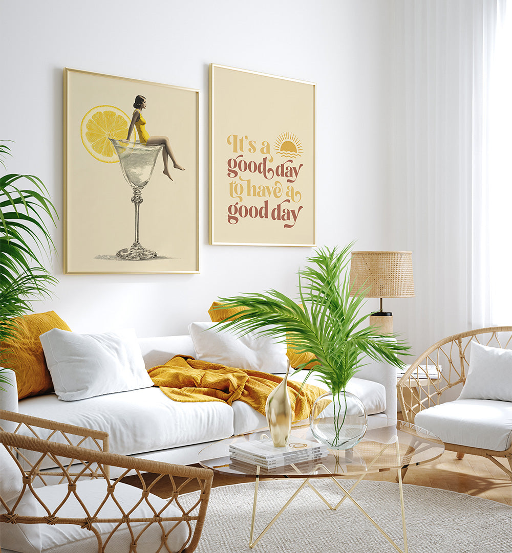 Modern living room with white sofa, wicker chairs, and decorative wall art.