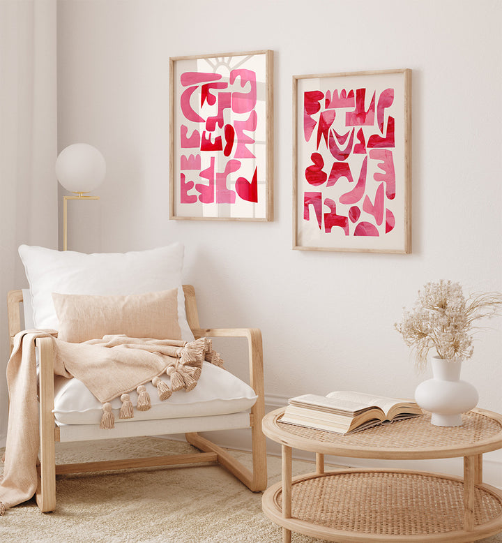 Living room with a wooden armchair, wicker coffee table, and abstract pink art on the wall.