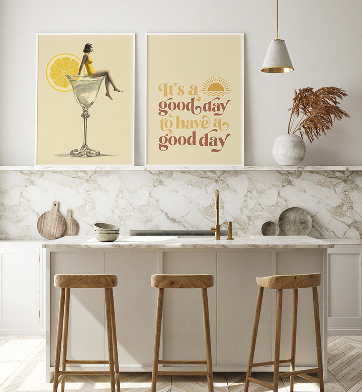 Modern kitchen interior with decorative posters and wooden stools.