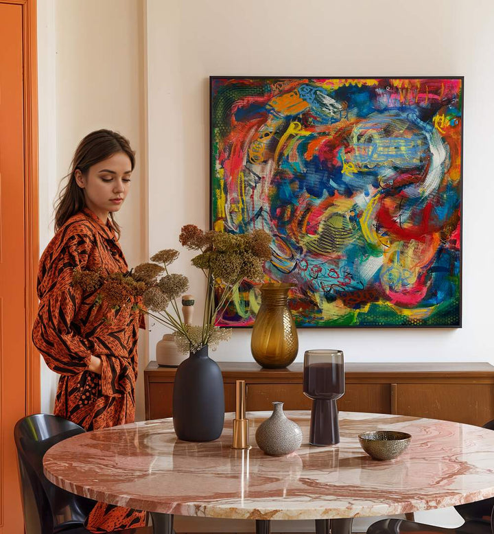 Stylish woman beside the BRONX WALLL, ABSTRACT PAINTINGS, showcasing vibrant colors in a chic living space.