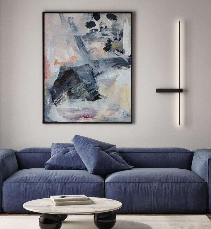 Stylish living room featuring LAYERS AND SHAPES, ABSTRACT PAINTINGS above a cozy blue sofa and modern decor.