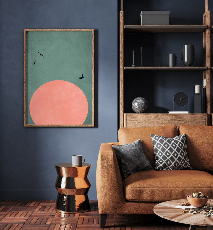 A Beautiful Day Landscape Art Artwork in Oak Wood Plain Frame Placed on a Blue Wall next to Wooden Shelf and a Brown Sofa in the Living Room