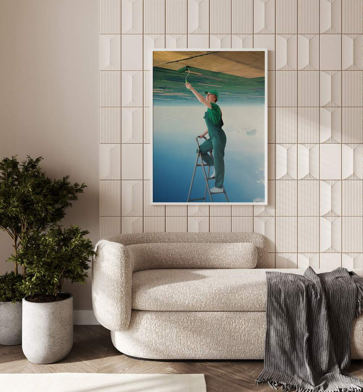 A Fresh Start Surreal Art Painting Artwork in plain white frame behind a sofa beside a plant