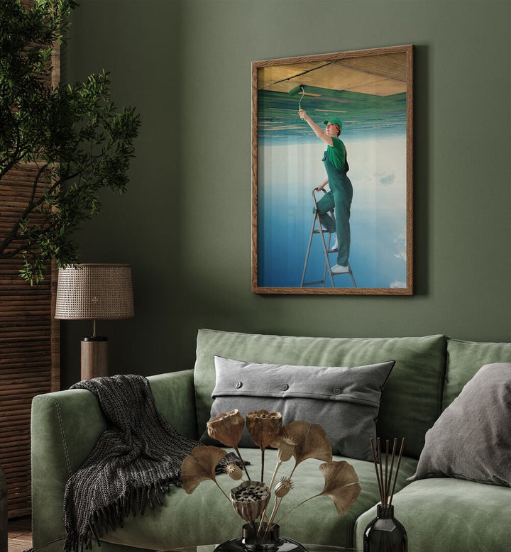 A Fresh Start Surreal Art Painting Artwork in plain oakwood frame behind a sofa on a green wall