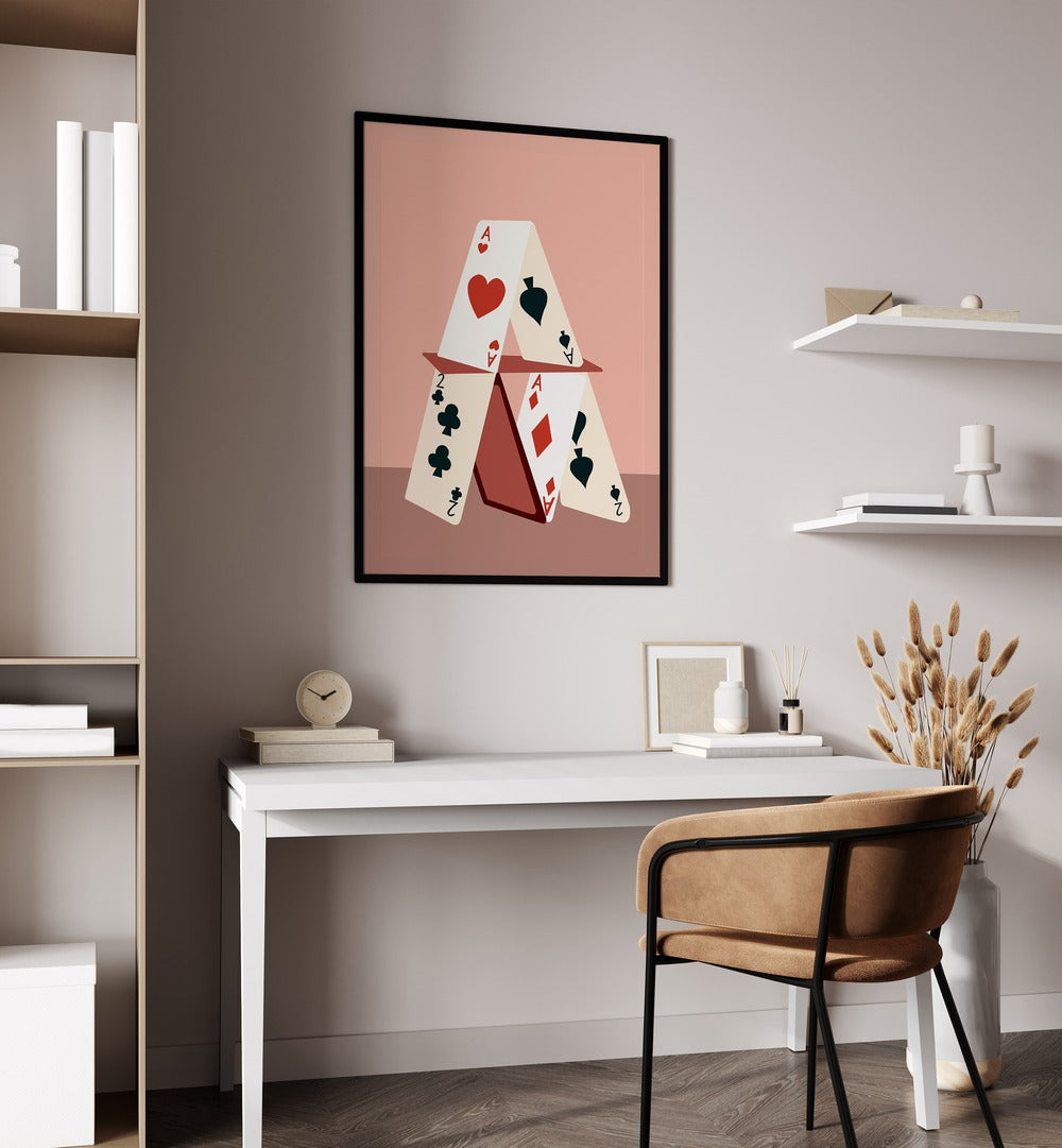 A House Made Of Cards By Uma Gokhale Gaming Poster in Black Plain Frame on a white wall above a study table