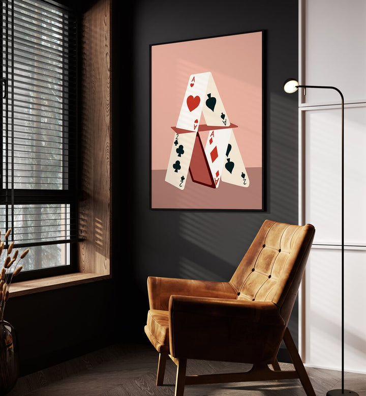 A House Made Of Cards By Uma Gokhale Gaming Poster in Black Plain Frame on wall beside an orange sofa