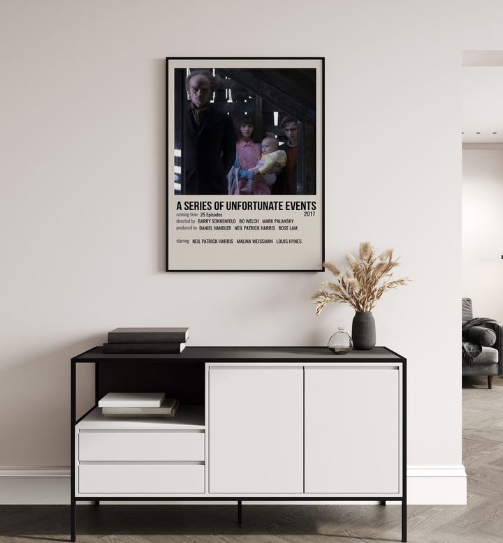 A Series Of Unfortunate Events 2017 Movie Posters in Black Plain Frame hanging on wall above console table