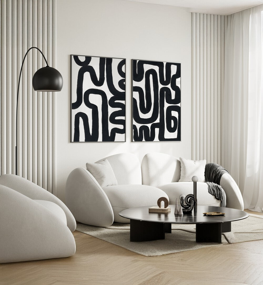 Modern living room featuring the ABSTRACT MAZE SET, SET OF 2 PAINTINGS, enhancing style and artistic flair.