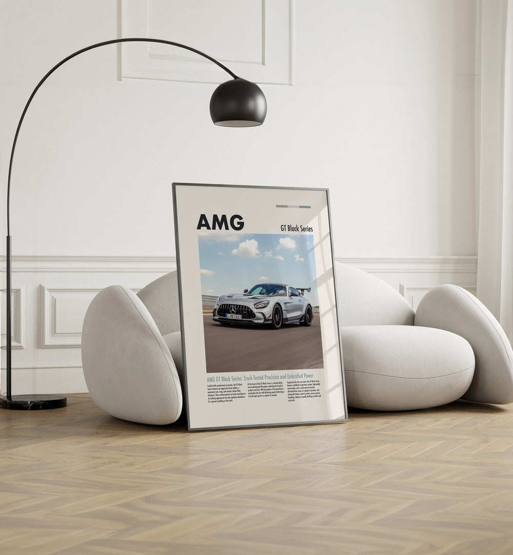 AMG GT Black Series Car Posters Automotive Wall Art Prints in Black Plain Frame placed on the floor near a White Sofa in the Living Room