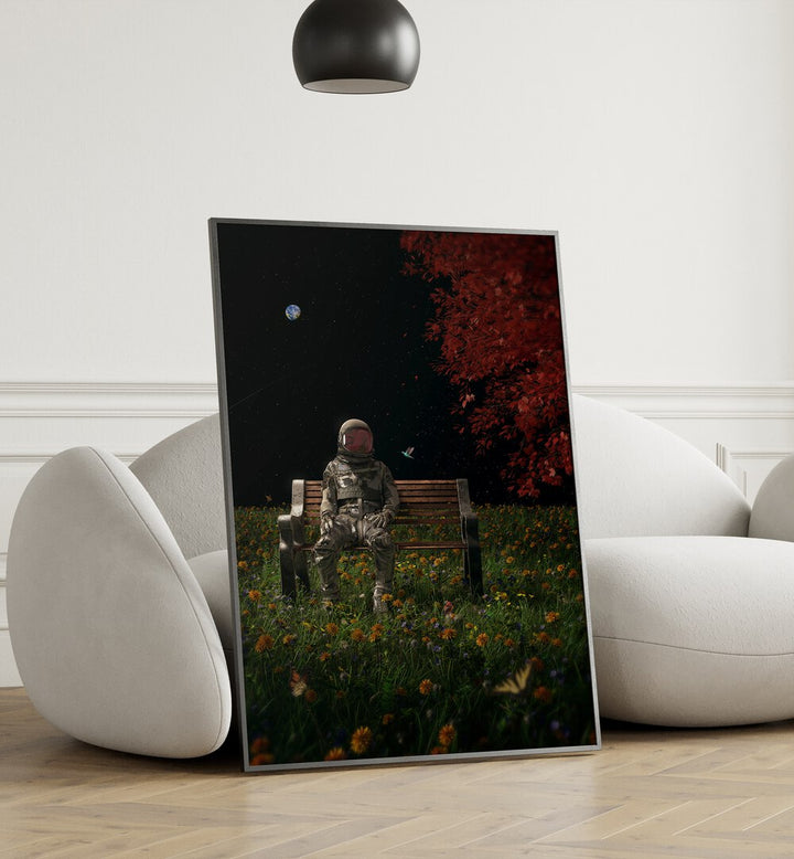 An Interlude By Francis Minoza Astronaut & Nasa Paintings, Space Art Prints Artwork in Black Plain Frame placed on a Wooden Floor near a White Sofa in the Living room