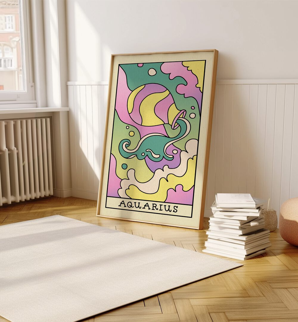 Aquarius Zodiac & Tarot Art Painting Artwork in plain oakwood frame on a wooden floor beside a stack of books