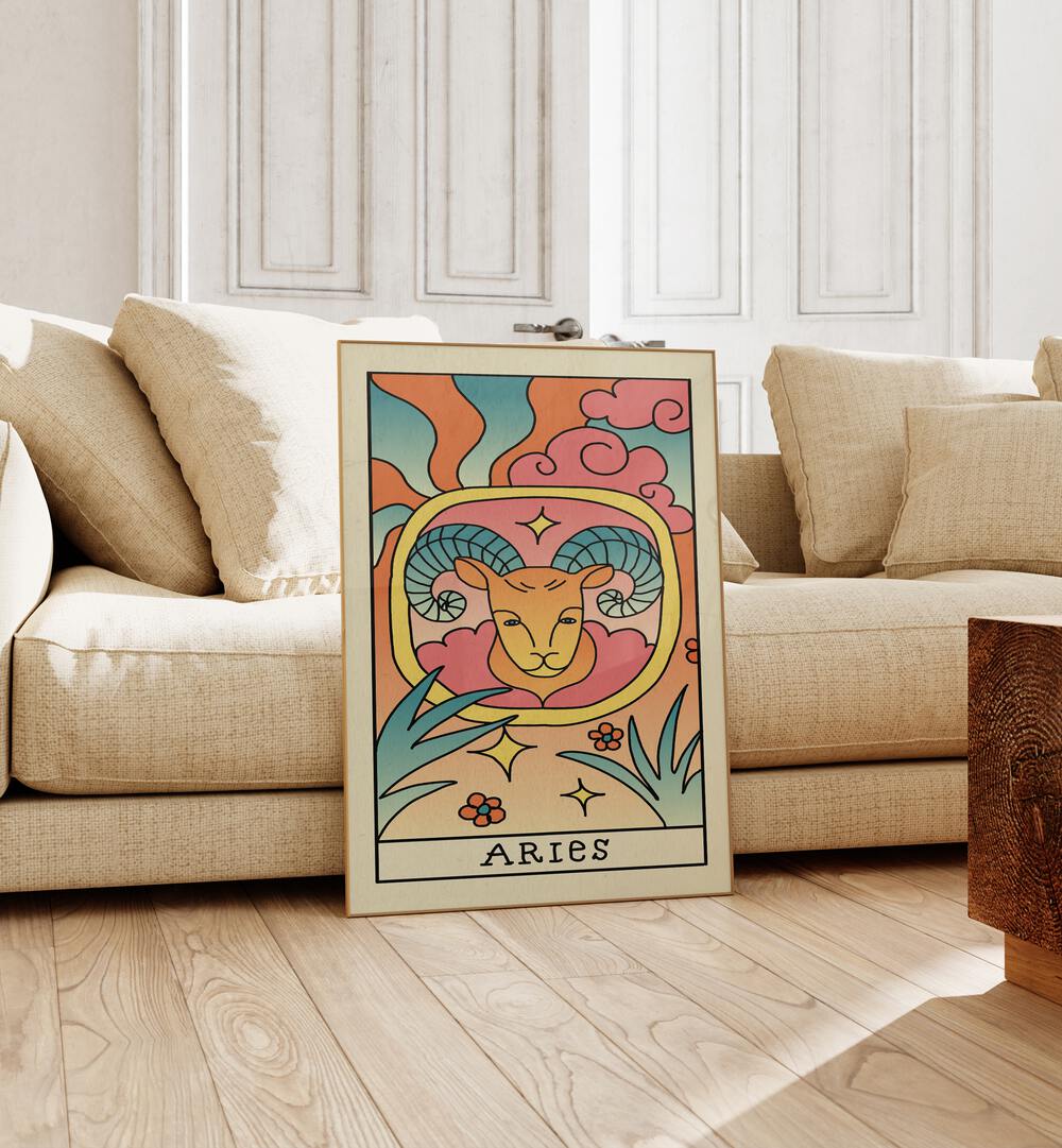 Aries Zodiac & Tarot Art Painting Artwork in plain oakwood frame beside a sofa 