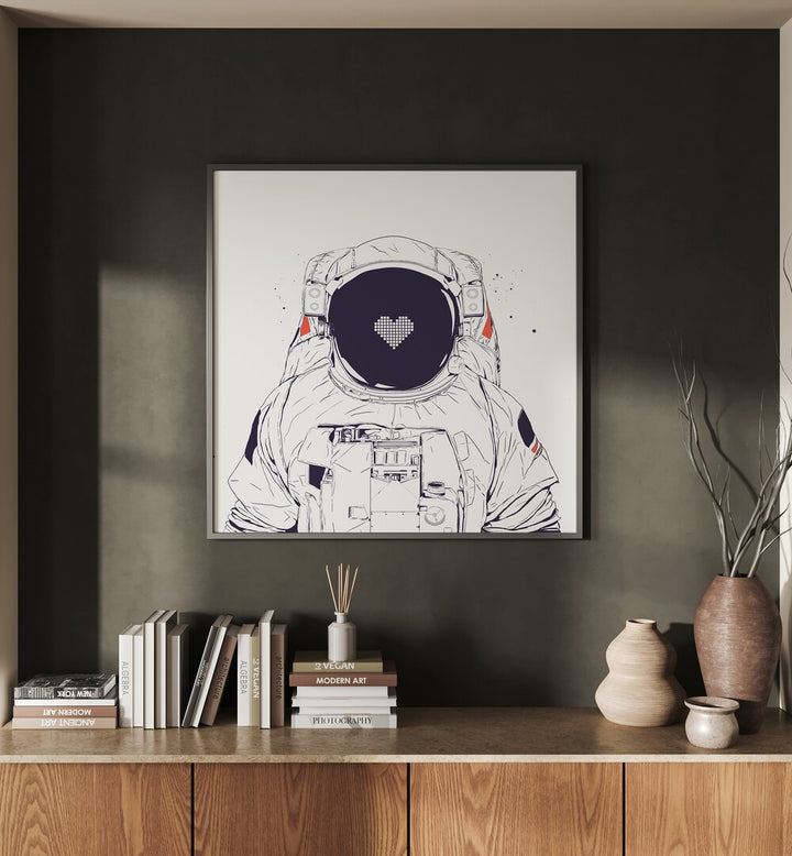 Astronaut Love By Balazs Solti Astronaut & Nasa Paintings, Space Art Prints Artwork in Black Plain Frame placed on a Dark Grey Colored Wall placed above a Console Table in the Drawing Room


