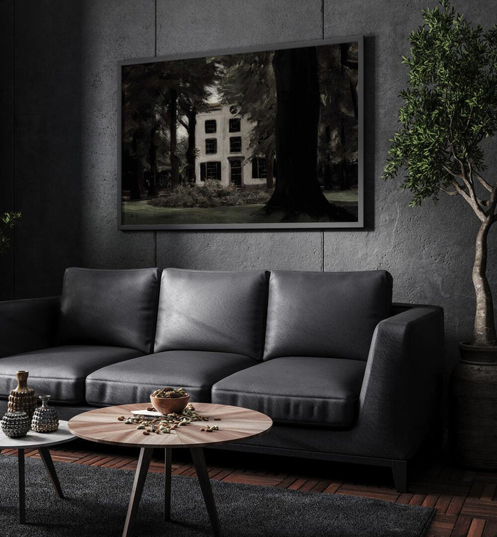 Abandoned Enclave Gothic Wall Art Prints in Black Plain Frame hanging on a wall above black leather couch beside a plant.