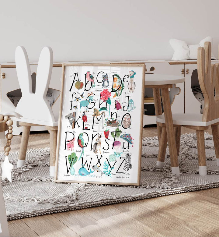 Abc Illustration By Caroline Bonne Muller Kids Room Painting in Oak Wood Plain Frame on the floor beside table and chairs