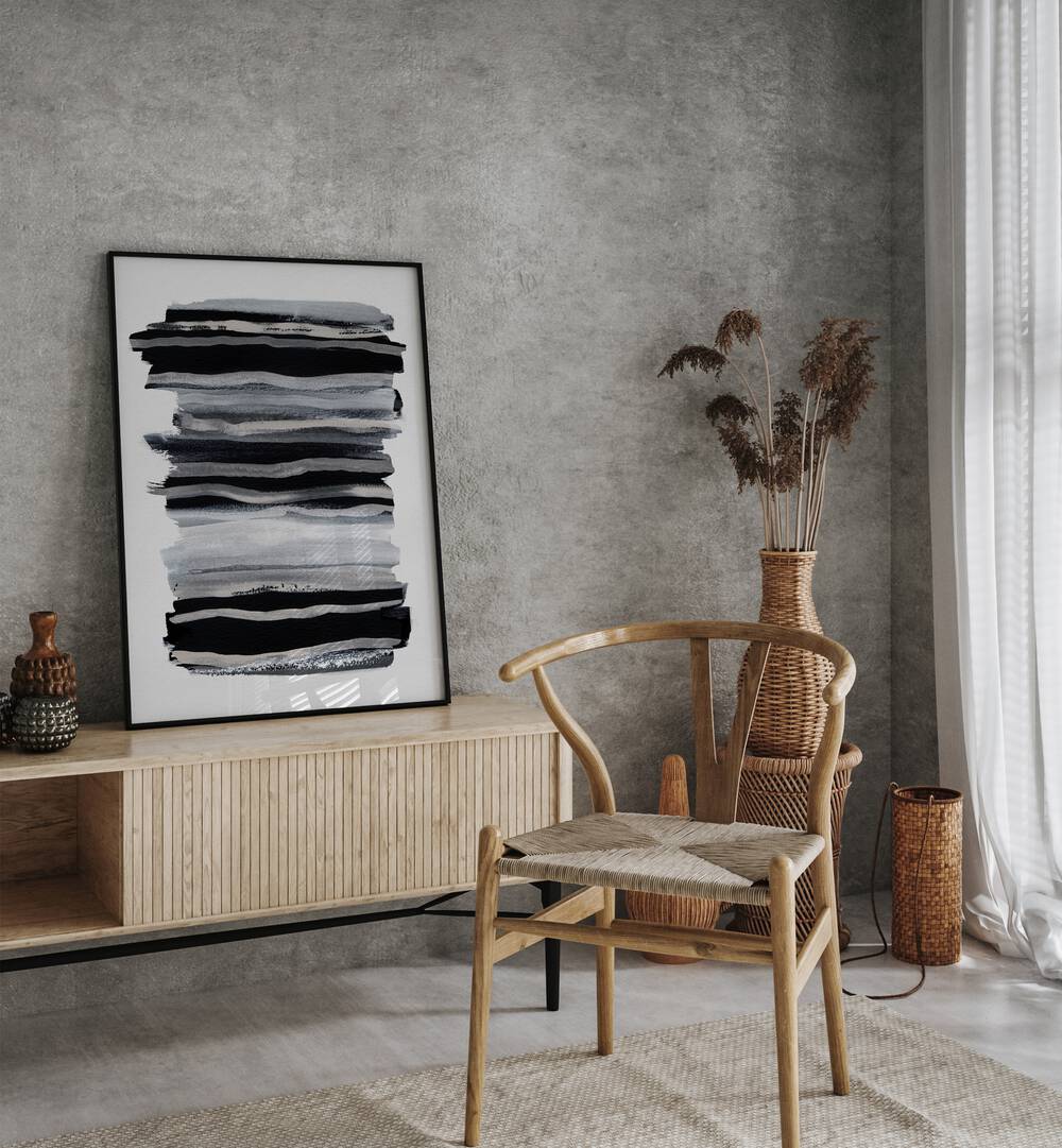 Abstract Black & White Brush Strokes By Mareike Bohmer Abstract Art Abstract Paintings in Black Plain Frame placed on a Console Table near a Grey Colored Wall in the Drawing Room