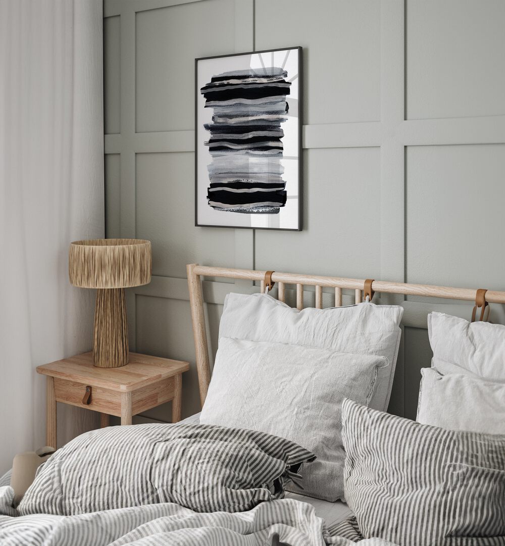 Abstract Black & White Brush Strokes By Mareike Bohmer Abstract Art Abstract Paintings in Black Plain Frame placed on a Grey Colored Wall near a Bed in the Bedroom