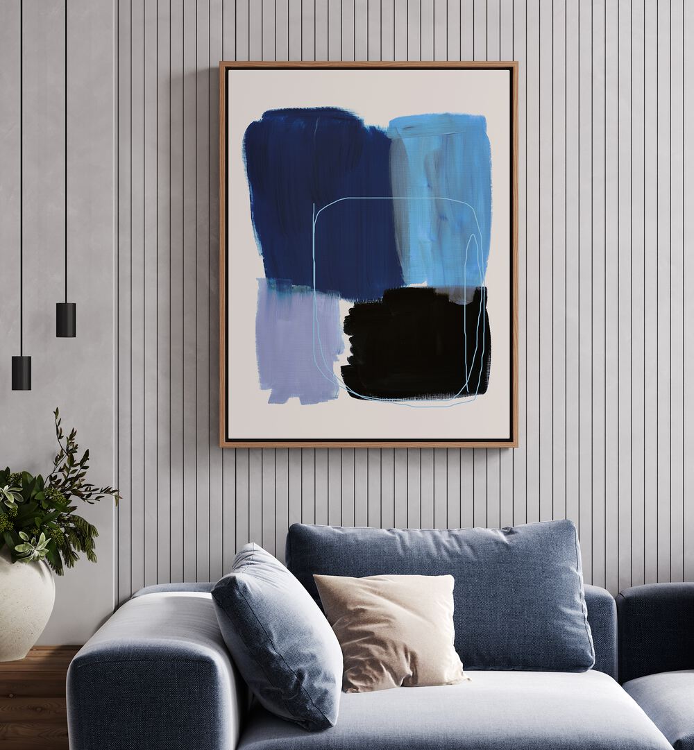 Abstract Blue Essence By Mareike Bohmer Abstract Art Abstract Paintings in Oak Wood Floater Frame placed on a Grey Colored Wall near a Blue Sofa in the Living Room