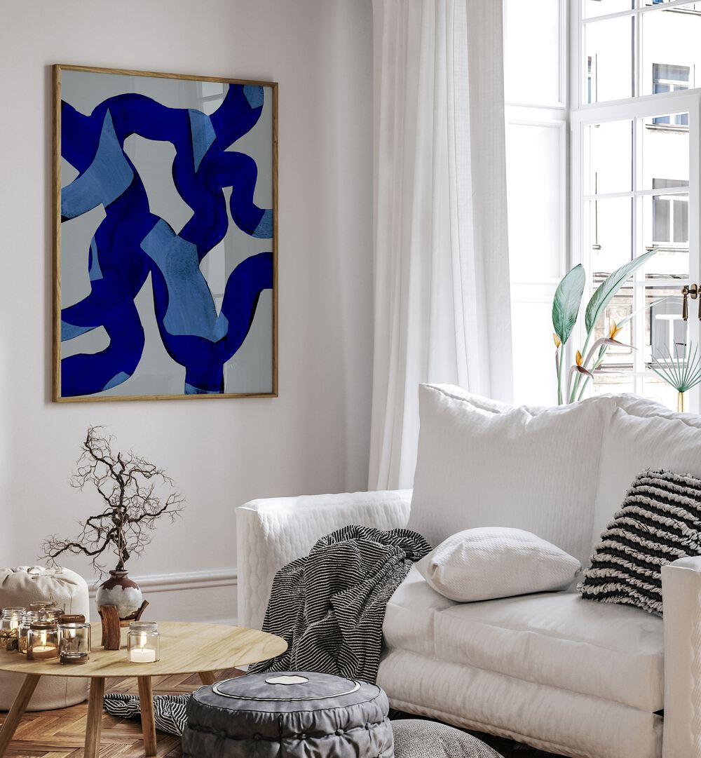 Abstract Brush Strokes Blue Tide By Mareike Bohmer Abstract Art Abstract Paintings in Oak Wood Plain Frame placed on a White Colored Wall near a White Sofa in the Living Room