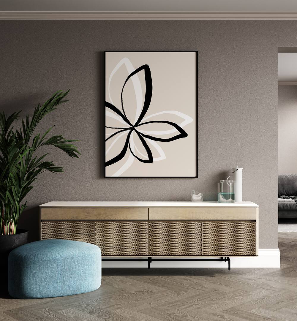 Abstract Flowers by Uplus Me Studio Floral Paintings Botanical Art Prints in Black Plain Frame placed on a wall behind a console table