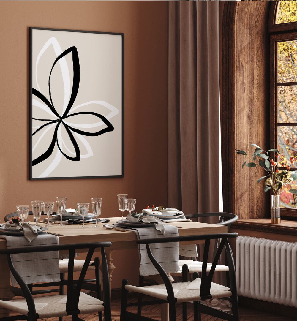 Abstract Flowers by Uplus Me Studio Floral Paintings Botanical Art Prints in Black Plain Frame placed on a wall behind a dining table for dining area