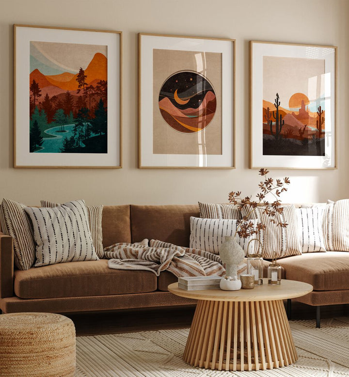 Abstract Landscape Set Of 3 Paintings in Oak Wood Frame With Mount placed on a living room wall behind a sofa