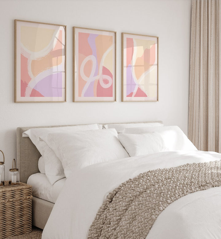 Abstract Ratios Set Of 3 Paintings in Oak Wood Frame With Mount placed behind a bed for bedroom