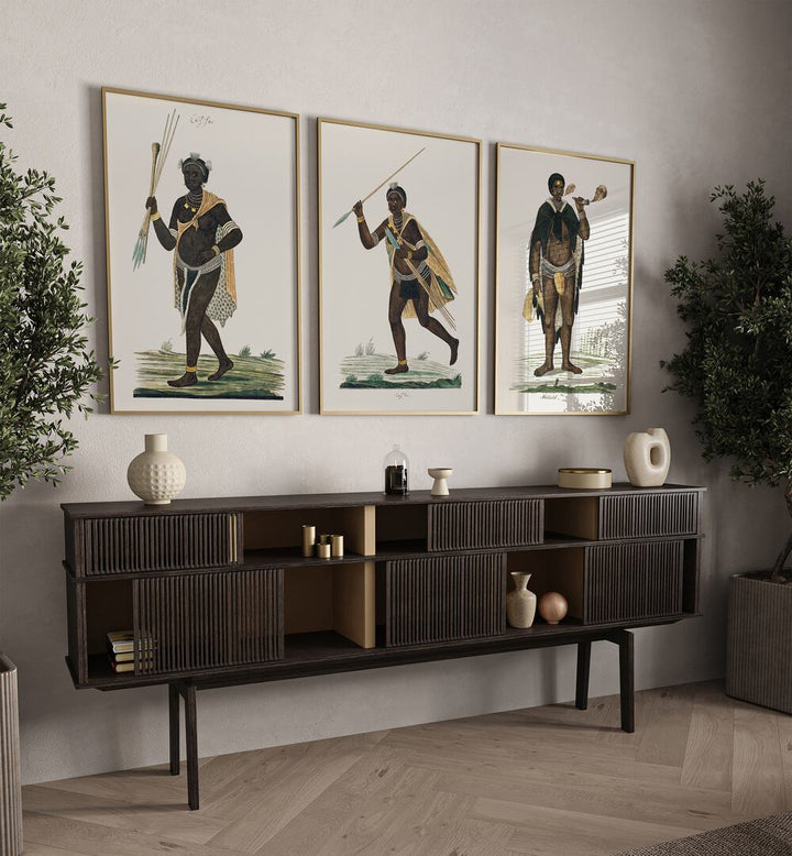 Africa Set Set Of 3 Paintings in Oak Wood Plain Frame placed on a wall behind a console table