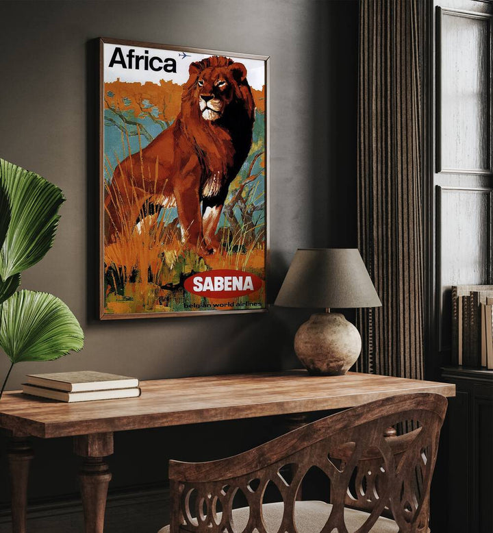 Africa-sabena Retro Vintage Travel Travel Posters in Oak Wood Plain Frame on a wall above a study table beside a lamp