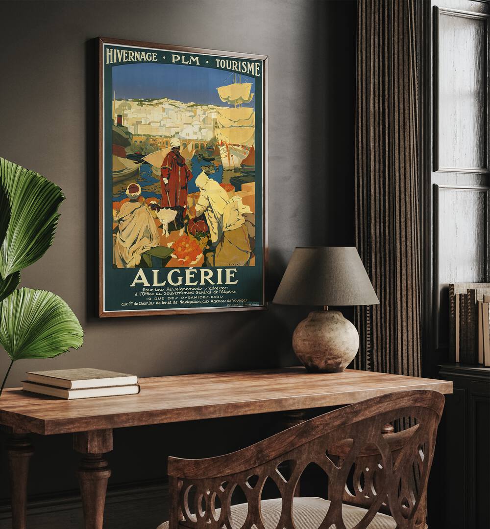 Algerie  Vintage Travel Posters in Dark Wood Plain Frame placed on a wall behind a study table