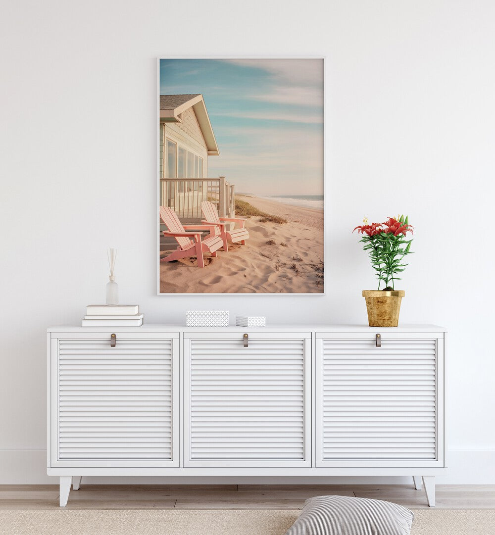 Serene coastal scene with pink chairs, featuring ALONG THE BEACH, BEACH PAINTINGS by Philippe Hugonnard for a tranquil home.