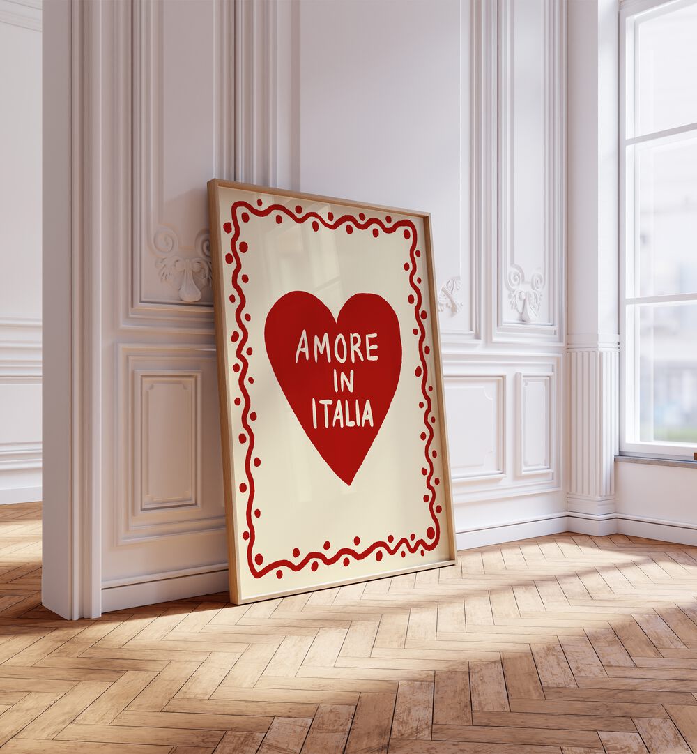 Amore in Italia by Studio Dolci Quotes Art Prints in Oak Wood Plain Frame placed on a floor beside a window