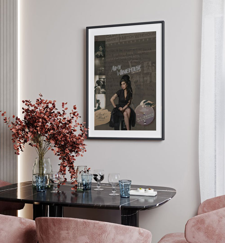 Amy Winehouse By Grishma Korjani Movie and Music Posters in Black Frame With Mount placed on a Cream Colored Wall near a Dining Table in the Dining Room