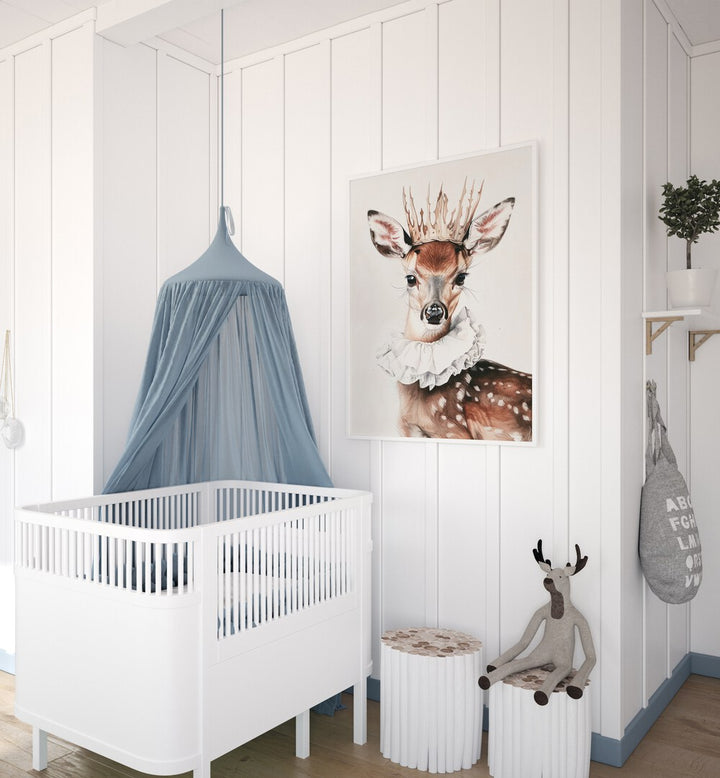 Antler-Crowned Prince Kids Room Paintings Kids Room Wall Art in White Plain Frame placed on a wall beside an infant's bed for kids room