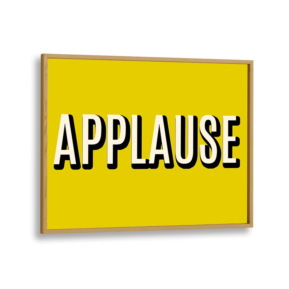 Bright yellow APPLAUSE poster in oak frame, perfect for enhancing spaces with inspiring APPLAUSE, QUOTES decor.