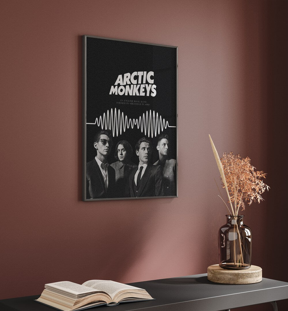 Arctic Monkeys By Grishma Korjani Movie Posters in Black Plain Frame placed on a Pink Colored Wall above a Console Table