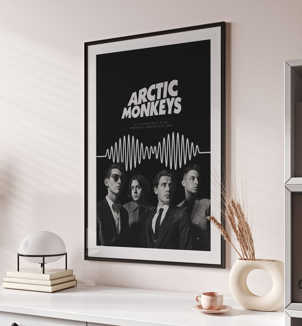 Arctic Monkeys By Grishma Korjani Movie Posters in Black Frame With Mount placed on a Cream Colored Wall above a Console Table