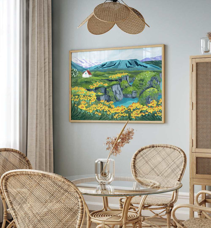 Arnarstapi By Sarah Gesek Landscape Art Prints in Oak Wood Plain Frame placed on a wall behind a dining table and beside a window for dining area