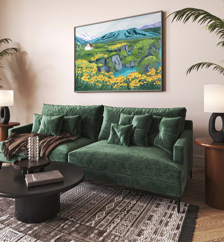 Arnarstapi By Sarah Gesek Landscape Art Prints in Black Plain Frame placed on a living room wall behind a green sofa