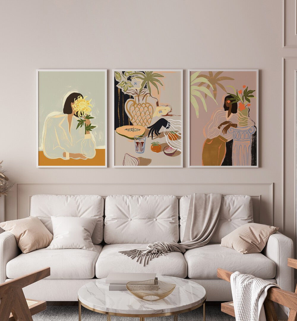 Arty Guava Artworks Set Set Of 3 Paintings in White Plain Frame placed on a wall behind  a white sofa