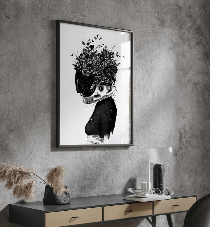 Astronaut Girl By Balazs Solti Art Prints in Black Plain Frame placed on a Dark Grey Colored Wall above a Console Table in the Drawing Room