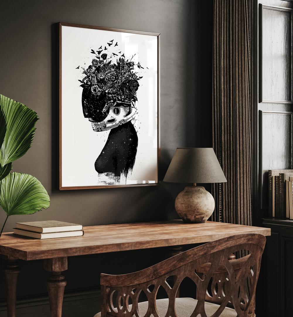 Astronaut Girl By Balazs Solti Art Prints in Dark Wood Plain Frame placed on a Brown Colored Wall near a Study Table in the Drawing Room