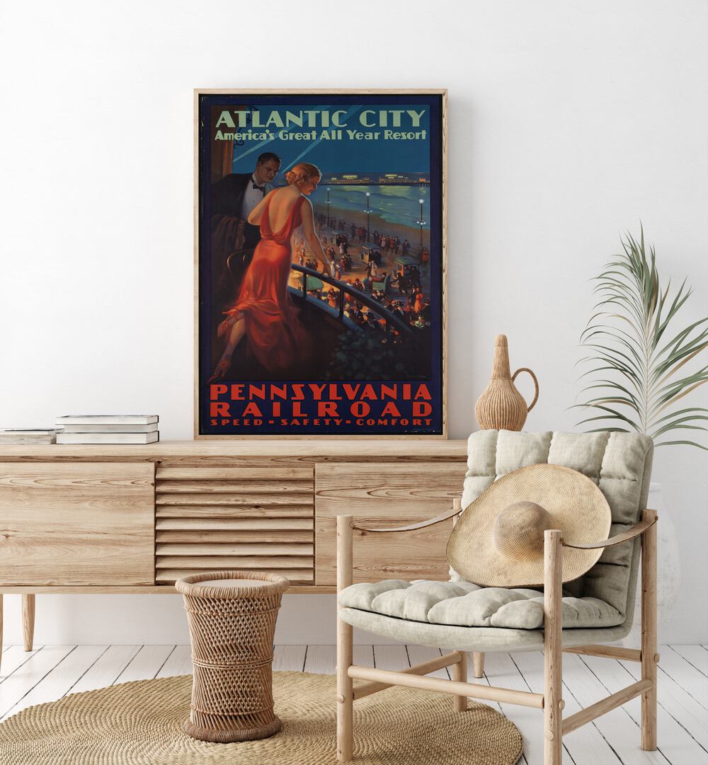 Atlantic City  Retro Travel Posters in Oak Wood Plain Frame placed on a console table behind a chair