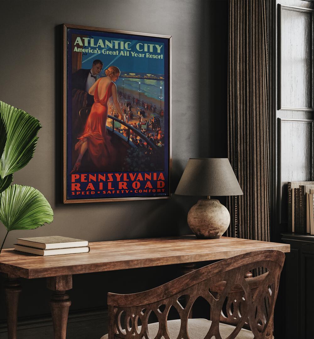 Atlantic City  Retro Travel Posters in Dark Wood Plain Frame placed on a wall behind a study table