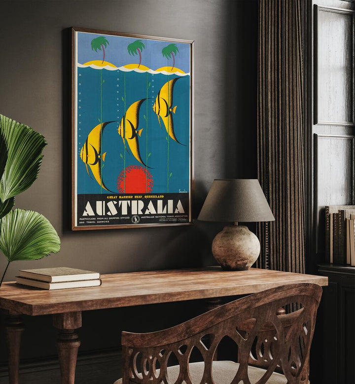 Australia Retro Vintage Travel Vintage Travel Posters in Dark Wood Plain Frame on a wall above a study table beside a lamp