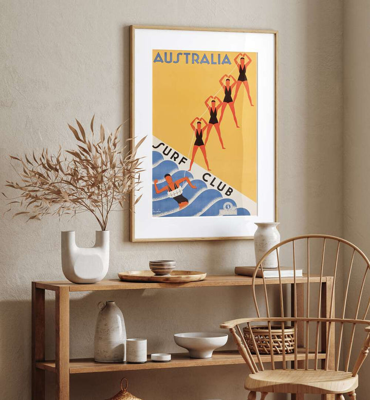 Australia Surf Club  Retro Travel Posters in Oak Wood Frame With Mount placed on a wall behind a table