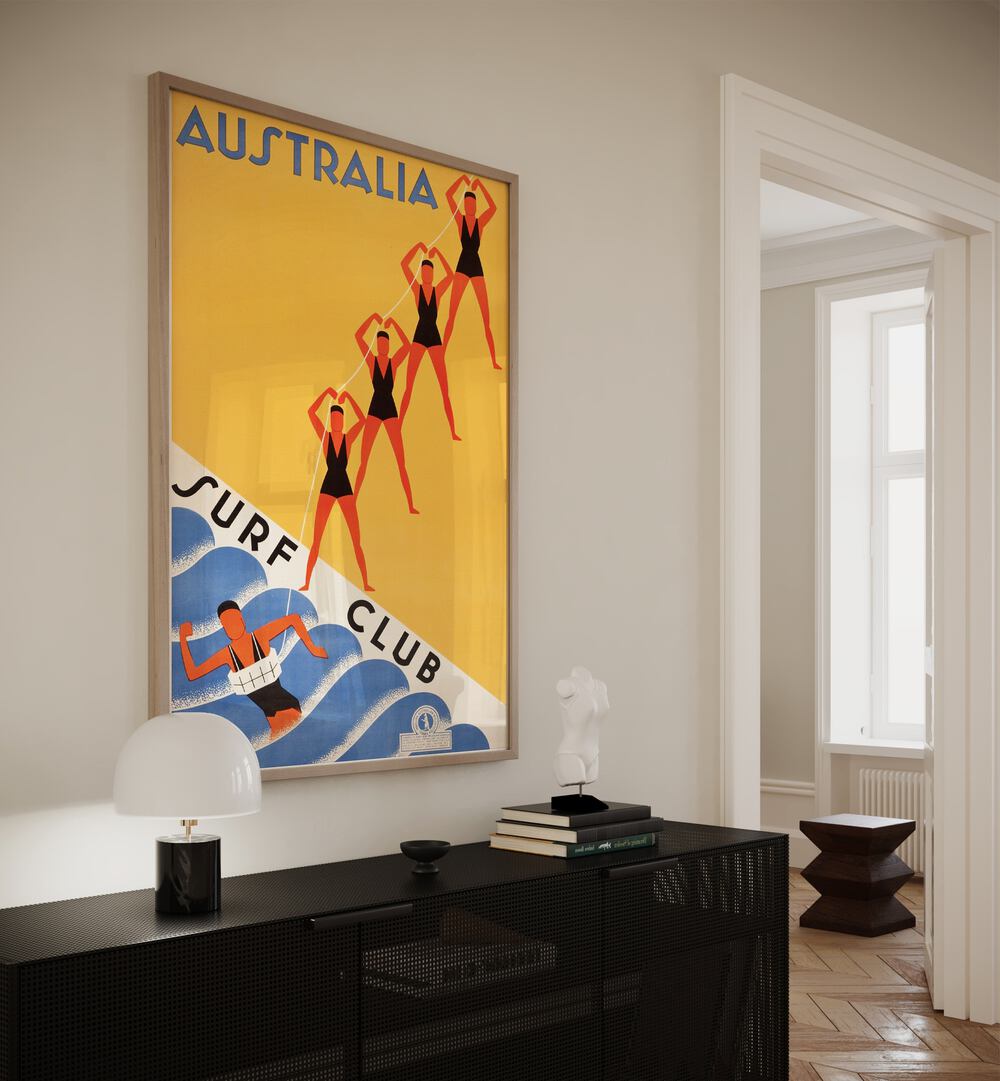 Australia Surf Club  Retro Travel Posters in Oak Wood Plain Frame placed on a wall behind a black table