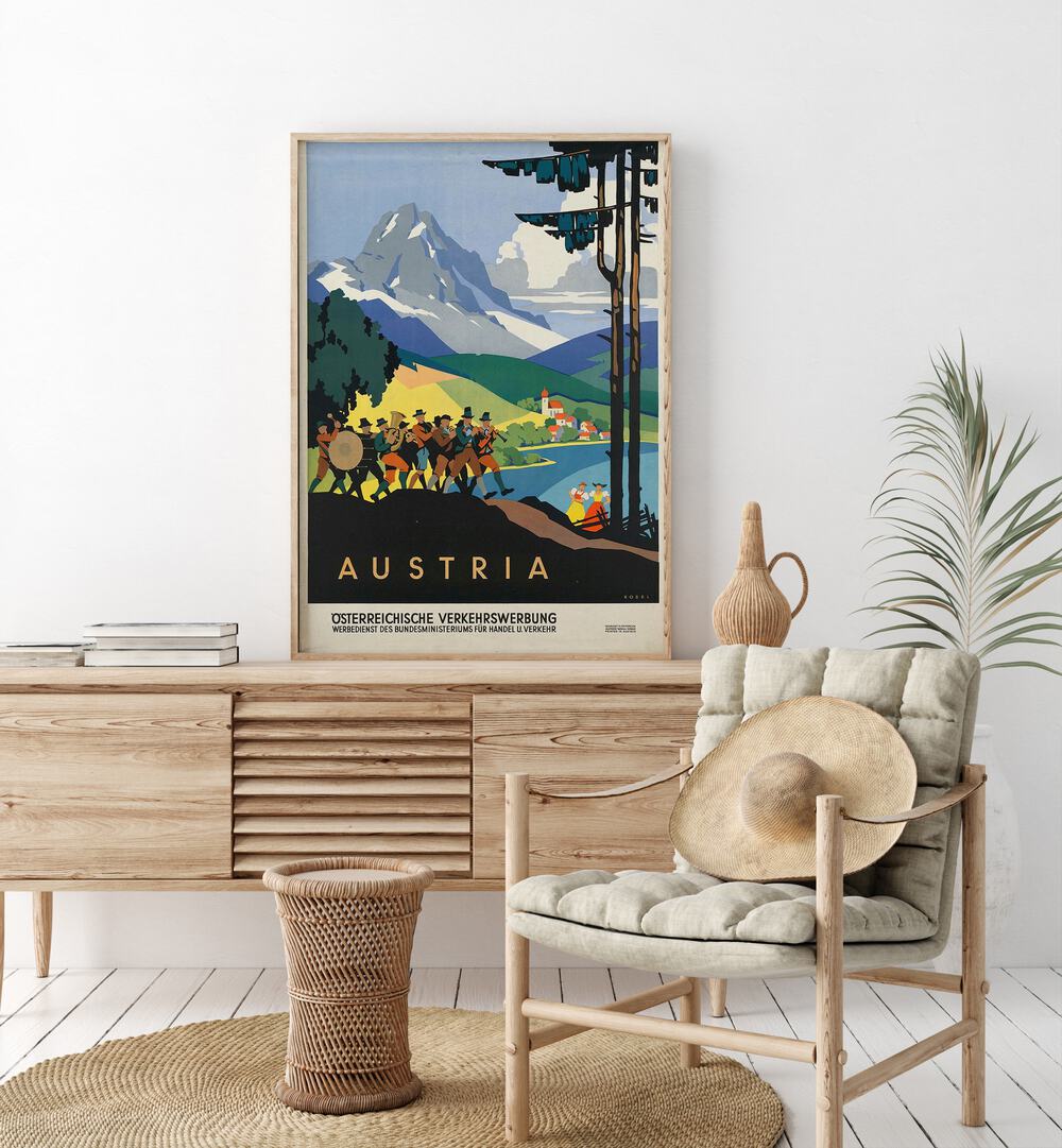 Austria Retro Vintage Travel Travel Posters in Oak Wood Plain Frame on a console table beside a plant