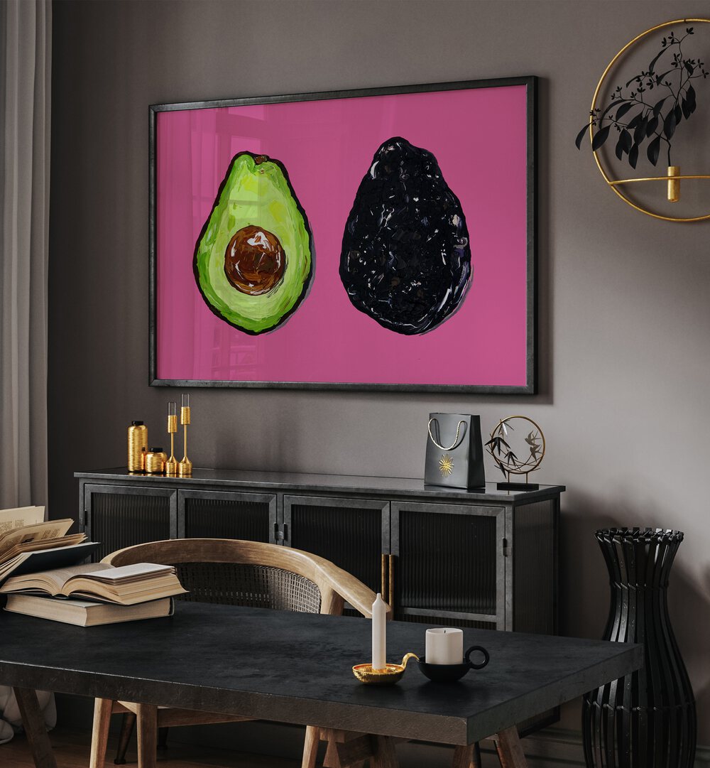 Avocado on Pink by Alice Straker Kitchen Posters Kitchen Art Prints in Black Plain Frame placed on a wall behind a console table